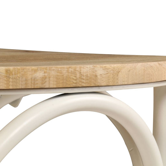 Close-up view of a solid mango wood table top with a white steel frame, showcasing a modern and sturdy design.