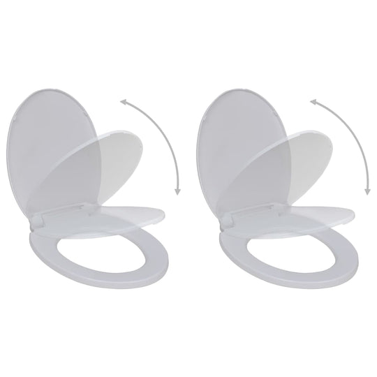 Two soft close toilet seats in white, designed for comfort and easy installation in standard toilet bowls.