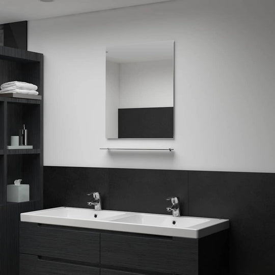 Wall mirror with shelf in modern bathroom, featuring tempered glass and minimal design, enhancing decor and functionality.