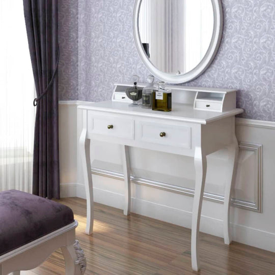 Modern white vanity makeup table with two drawers and a round mirror in a stylish bedroom setting. مفروشات FURNITURE أثاث.