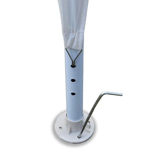 White party tent pole and base with adjustment holes and anchoring tool for secure outdoor setup.