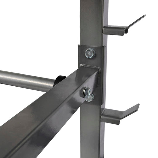 Close-up of the sturdy metal construction of a dumbbell barbell rack with heavy-duty steel frame and secure attachments.