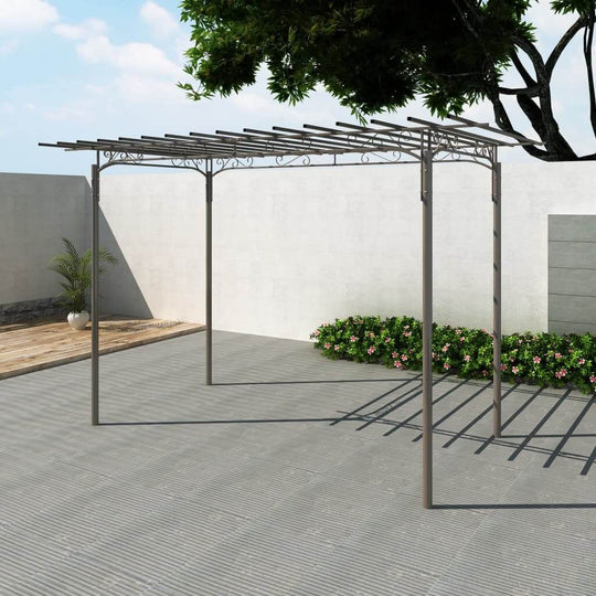 Steel garden arbor with pavilion design, ideal for outdoor furniture and climbing plants in a landscaped patio setting.