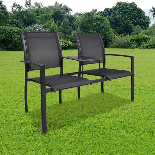 2 seater garden bench in black steel and textilene, featuring a central shelf for drinks, set on a grassy outdoor background.