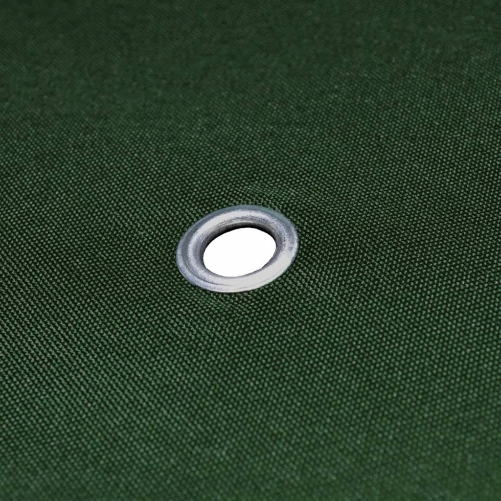 Close-up of a grommet on a green gazebo cover, enhancing durability for outdoor furniture protection.