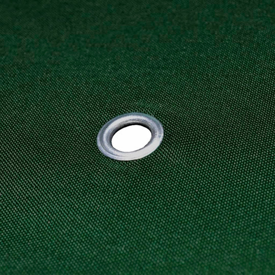 Close-up of a grommet on a green gazebo cover, enhancing durability for outdoor furniture protection.