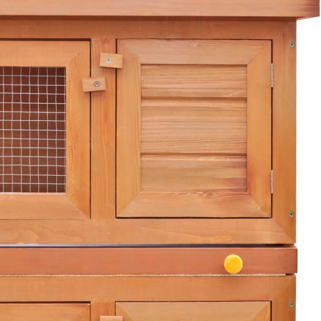 Close-up of wooden outdoor rabbit hutch doors with wire mesh for ventilation and safety. Ideal for small animal housing.