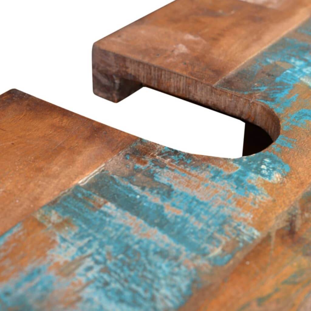 Close-up of reclaimed wood surface with blue paint and a sink cutout, showcasing unique texture and craftsmanship.