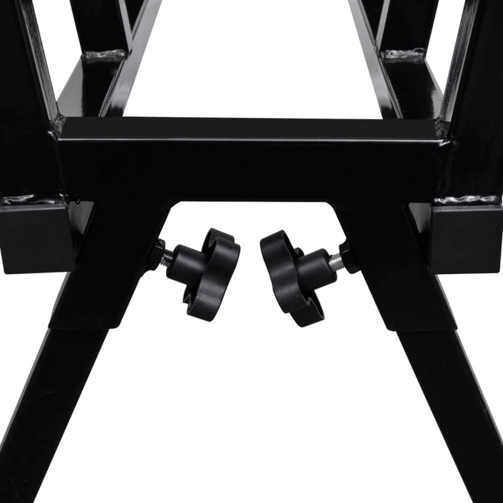 Close-up of adjustable feet on a black powder-coated sawhorse for stability in woodworking projects.