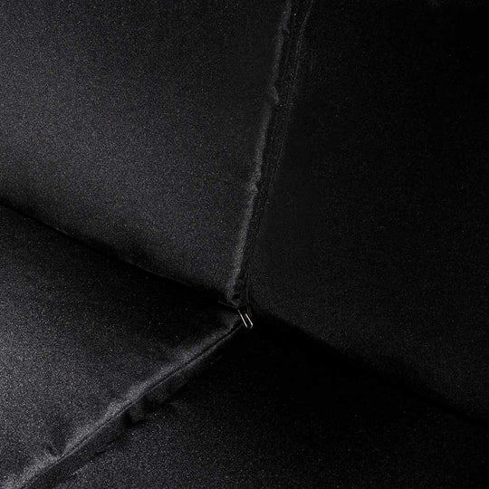 Piece Garden Lounge Close-up of black removable cushion fabric showing zipper detail for outdoor furniture comfort and style.