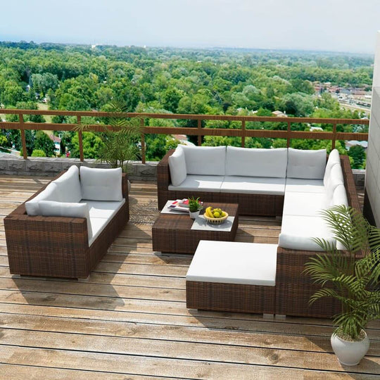 10 piece garden lounge set with cushions, PE rattan outdoor sofa on a patio with greenery in the background.