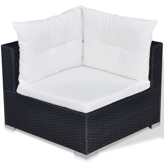 Corner seat from a 10 piece garden lounge set with plush white cushions and durable black rattan frame.