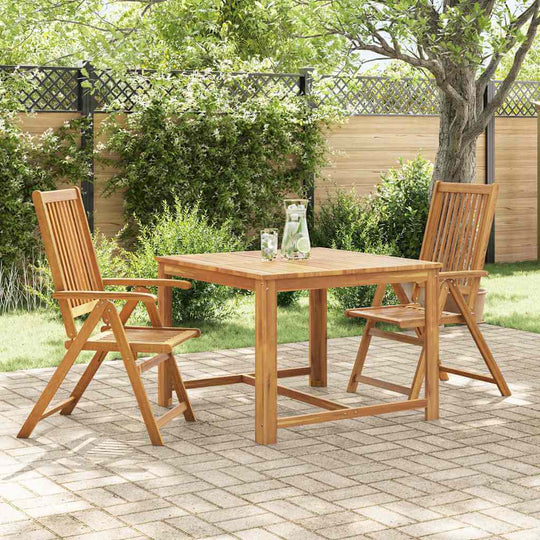 Folding Garden Chairs 2 pcs Solid Acacia Wood set on a patio with table, surrounded by greenery.
