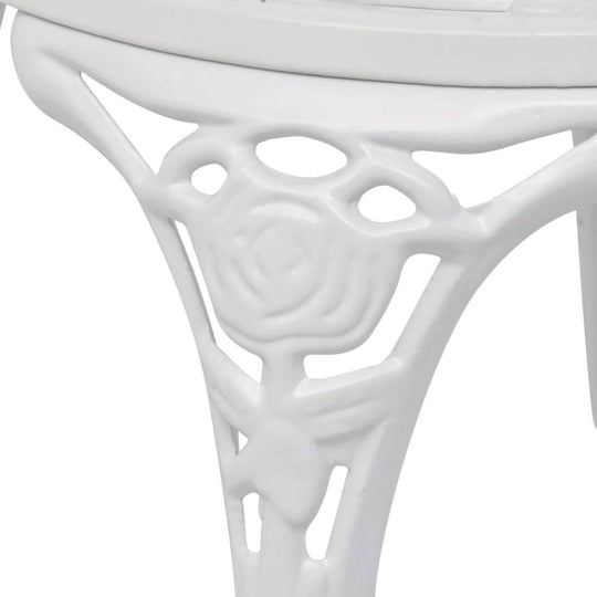 Close-up of detailed floral pattern on the leg of the 3 Piece Bistro Set Cast Aluminium, showcasing intricate design.