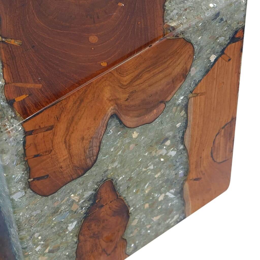 Close-up of a rustic solid teak wood stool with transparent resin, ideal for outdoor furniture and patio settings.