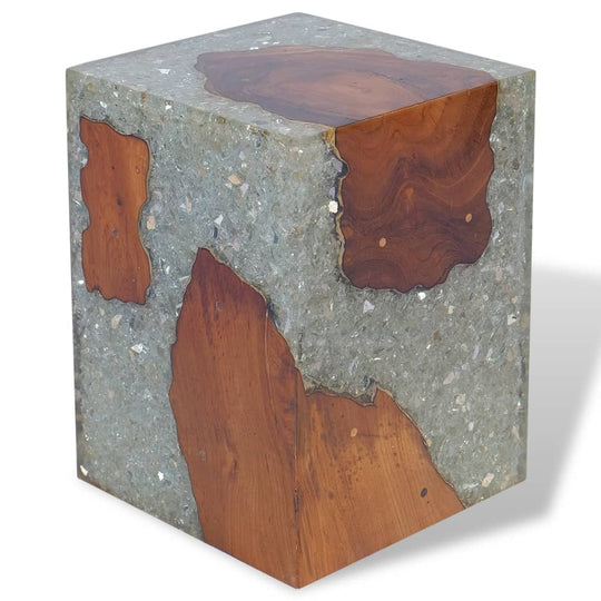 Solid teak wood and resin stool, ideal for outdoor furniture and patio settings, showcasing rustic charm and craftsmanship.