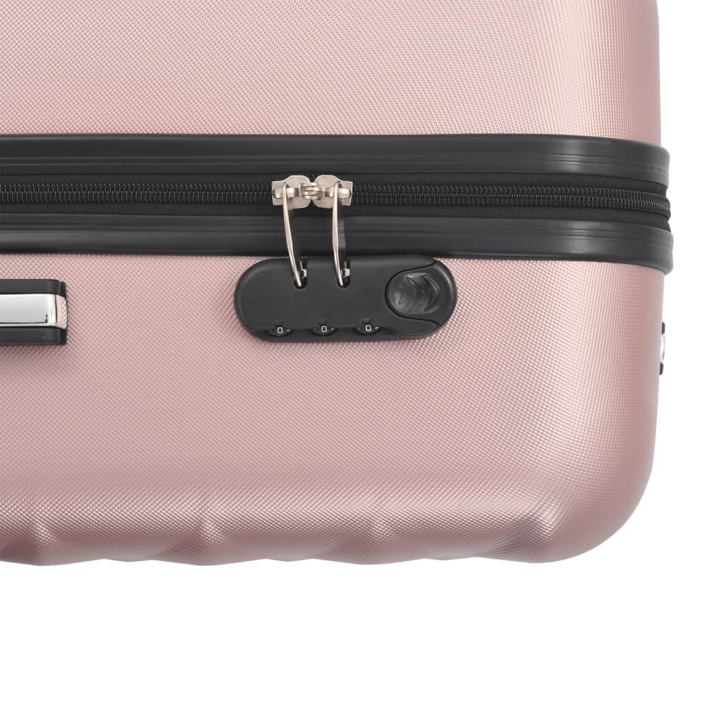 Close-up of rose gold hardcase trolley with security locks and zipper for safe travel.