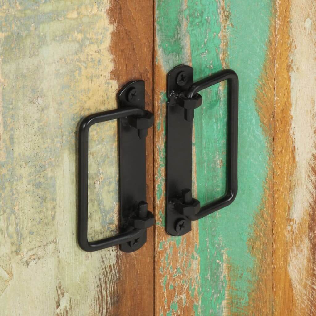 Black metal handles on a colorful reclaimed wood sideboard, showcasing vintage and industrial design.