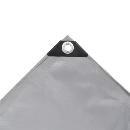 Grey tarpaulin corner with grommet, ideal for protecting outdoor furniture and equipment from the elements.