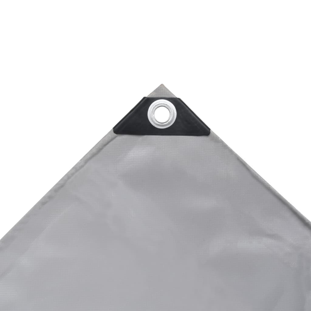 Corner detail of a grey heavy-duty tarpaulin with grommet for secure fastening and durability against the elements.