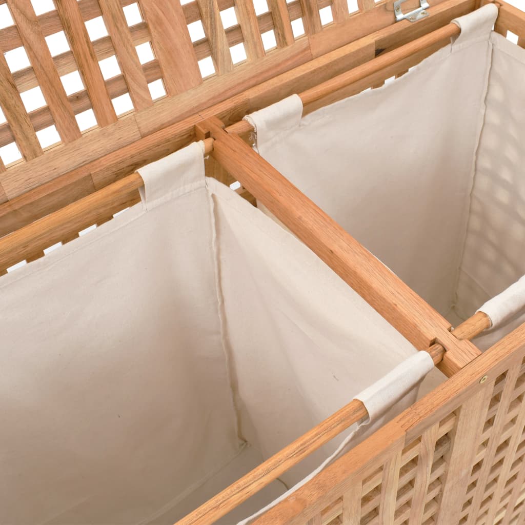 Wooden laundry bin with lattice design and two separate fabric compartments for organized storage. Ideal for bathroom or bedroom furniture.