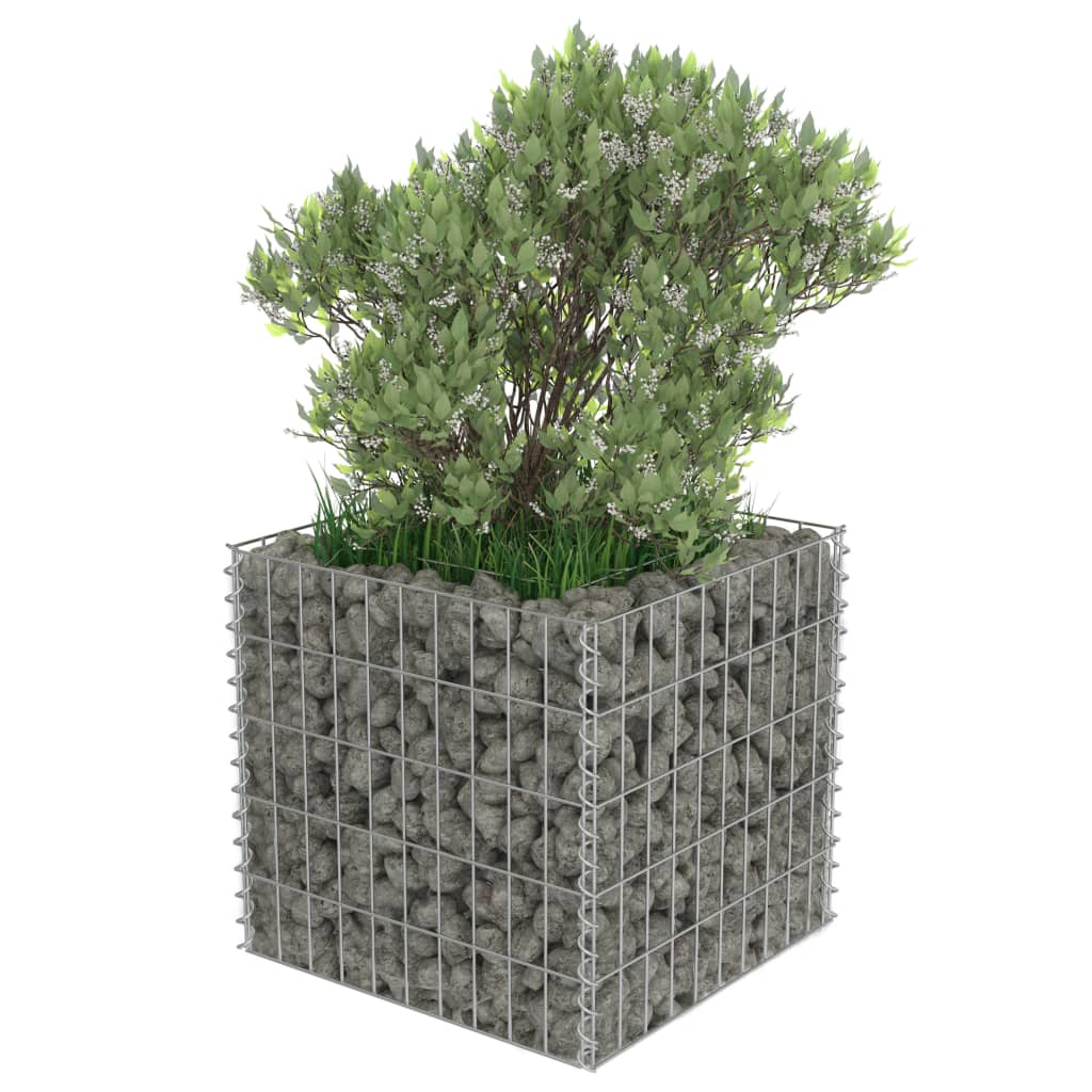 Gabion raised bed filled with rocks, featuring greenery and designed for garden or patio use.