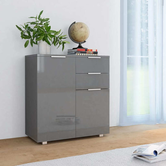 High gloss grey sideboard with two drawers and two doors, styled with a globe and plant in a bright room.