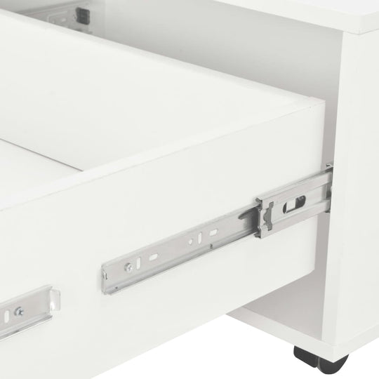 Close-up of a high gloss white coffee table drawer showing metal slide rails for smooth opening and closing.