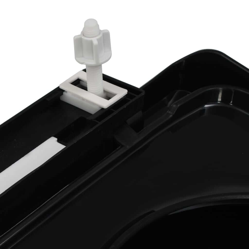 close-up of black toilet seat quick-release mechanism for easy installation and cleaning in home and commercial settings.