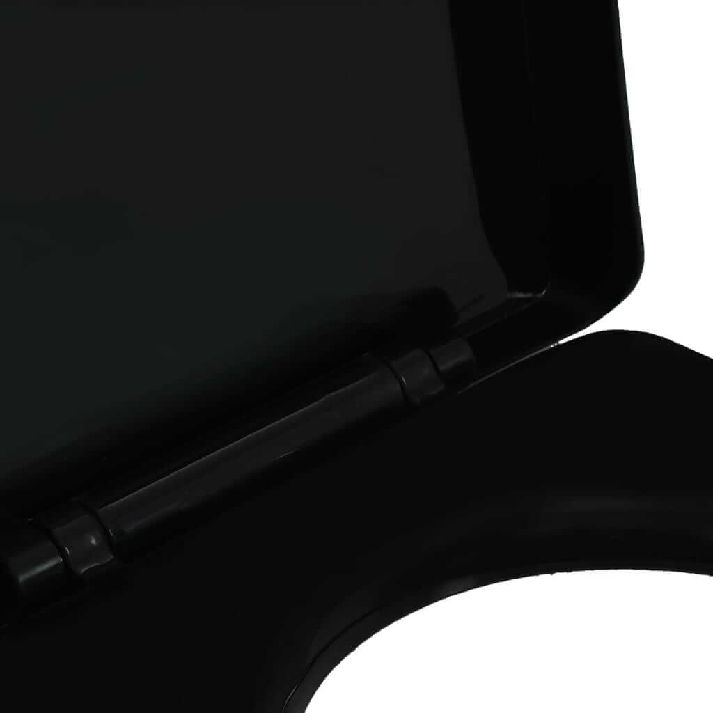 Close-up of a soft-close toilet seat with quick-release design, featuring a sleek black finish and sturdy hinge.