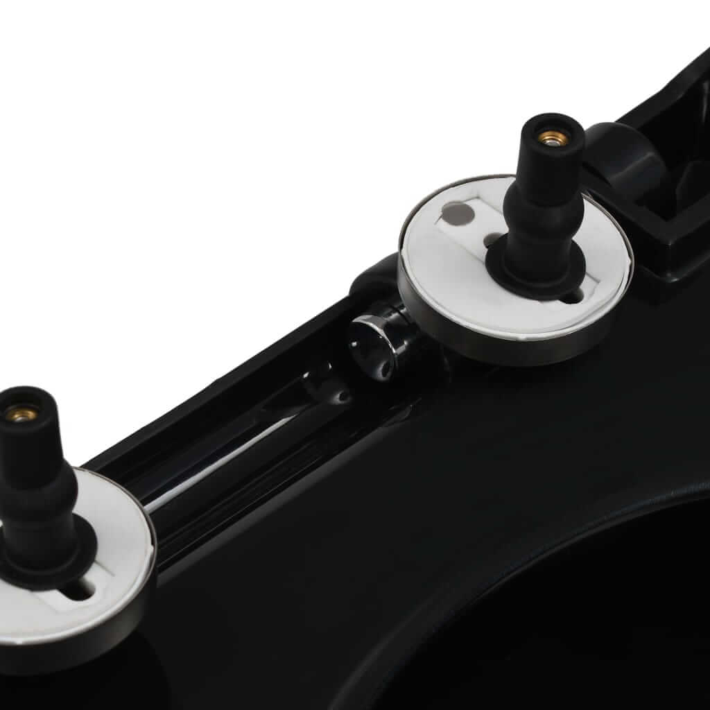 Close-up of the quick-release design fittings on a black soft-close toilet seat for easy installation and cleaning.