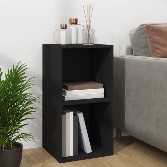 Stylish black vinyl storage box with two compartments, perfect for organizing books and accessories in modern furniture settings.