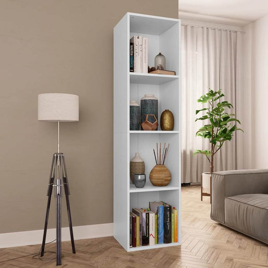 White book cabinet with four compartments, stylish decor and ample storage for books and decor items in a modern living room.