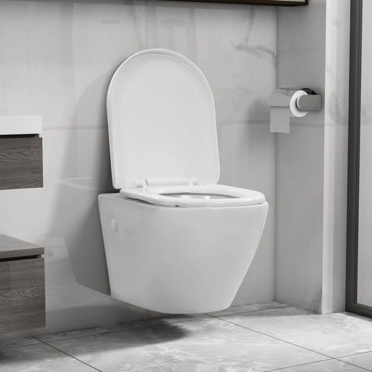 Wall hung rimless toilet in white ceramic, designed for easy cleaning and space-saving in modern bathrooms.