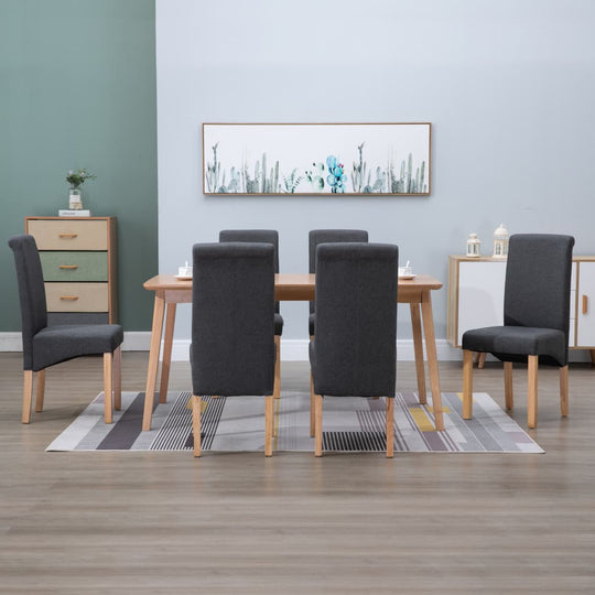 Set of 6 grey fabric dining chairs around a wooden table in a stylish dining room, ideal for home and garden furniture.