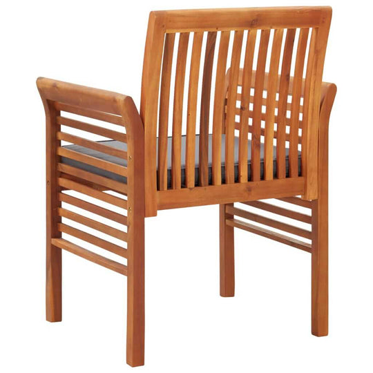 Solid acacia wood garden dining chair with cushions, featuring a classic slatted design for outdoor comfort.