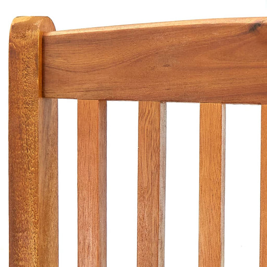 Close-up of the solid acacia wood finish on a contemporary outdoor folding chair, highlighting its natural beauty and durability.