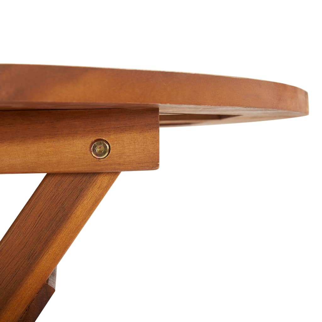 Close-up of folding garden table edge, showcasing solid acacia wood craftsmanship and metal fastening details.