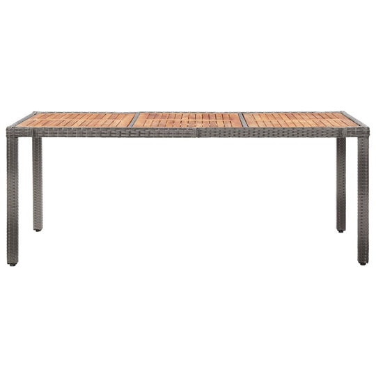 Elegant outdoor dining table with poly rattan frame and wooden slats, perfect for patio or garden use.