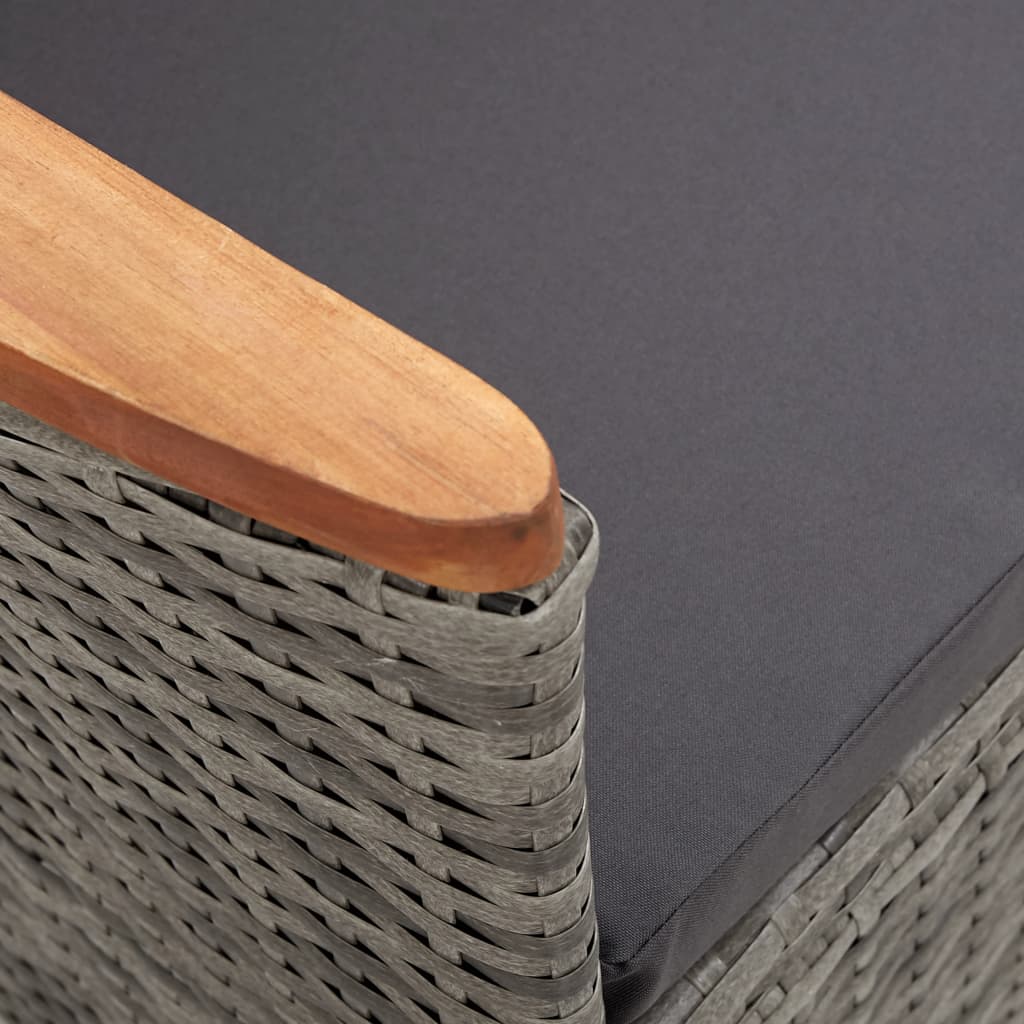 Close-up of the grey poly rattan outdoor chair with wooden armrest and cushion, perfect for stylish garden furniture.