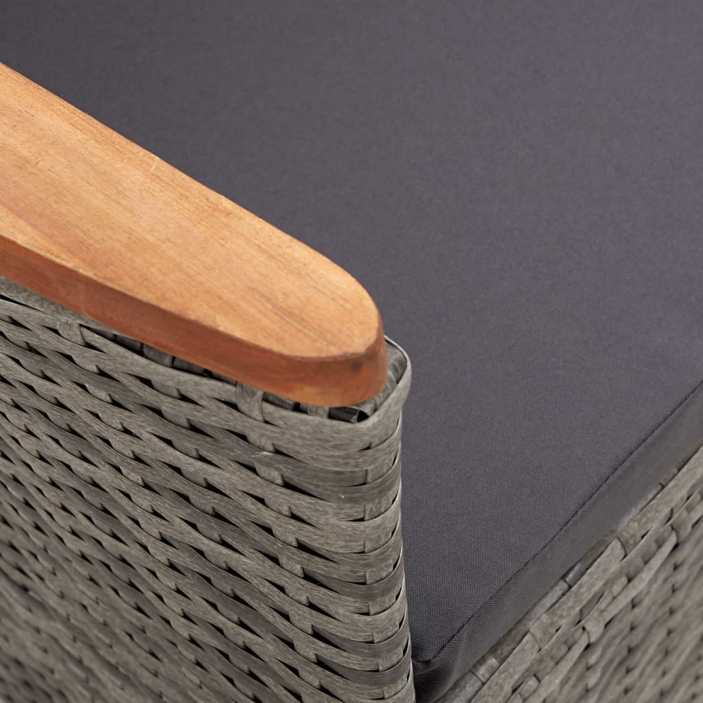 Close-up of the grey poly rattan armchair with wooden armrest from the 7 piece outdoor dining set, showcasing elegant design.