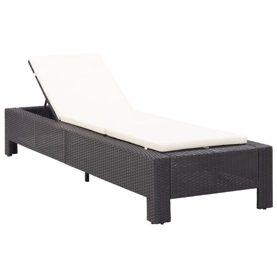 Comfortable black poly rattan sunbed with white cushion, perfect for relaxing by the pool or on the patio.