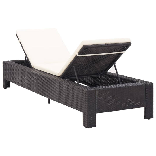 Black poly rattan sunbed with cushion, adjustable backrest, perfect for poolside or patio relaxation.