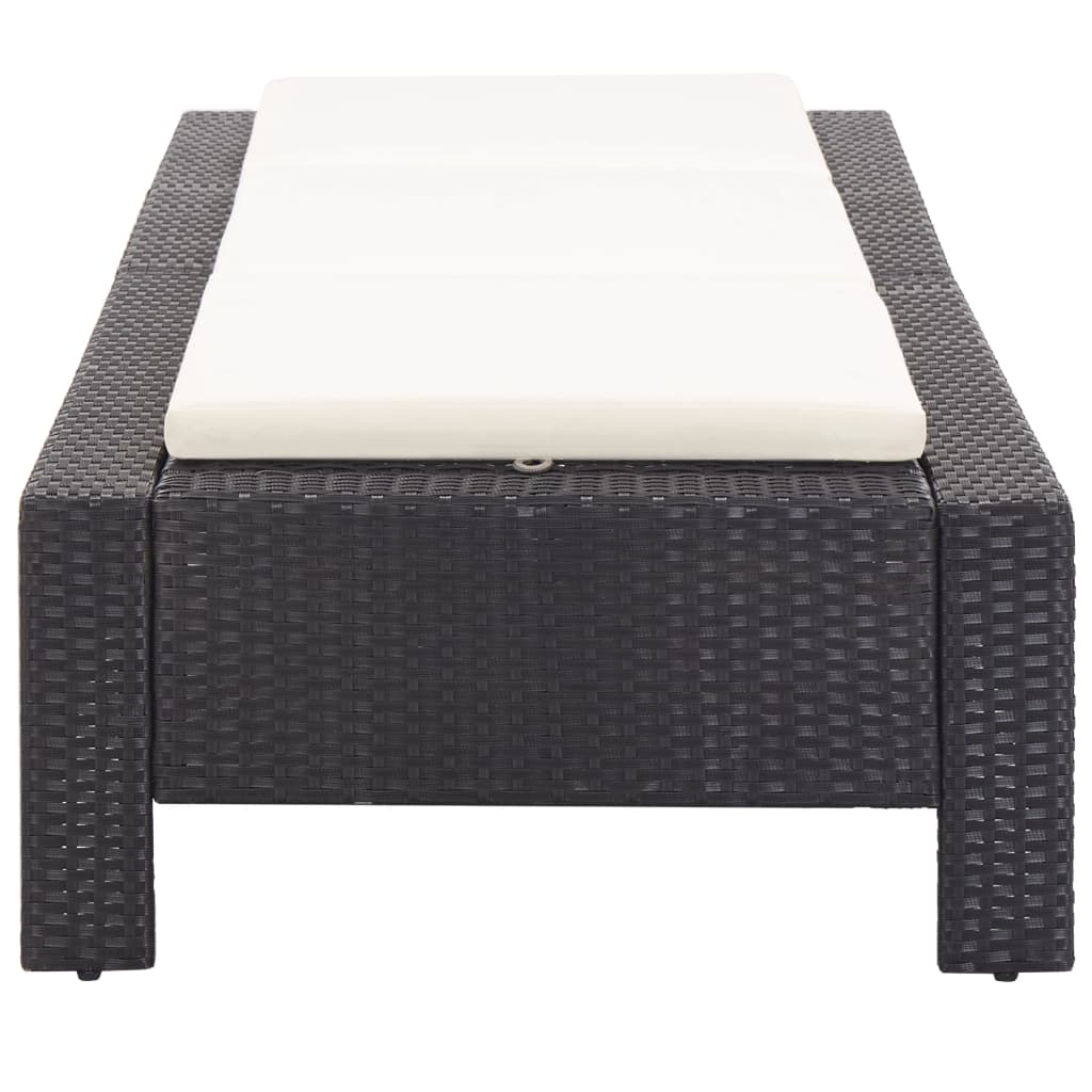 Black poly rattan sunbed with cushion, perfect for relaxing by the pool or patio, featuring weather-resistant design.