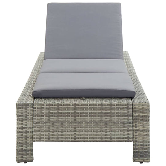 Comfortable grey poly rattan sunbed with cushion, perfect for relaxing by the pool or patio. Weather resistant design.