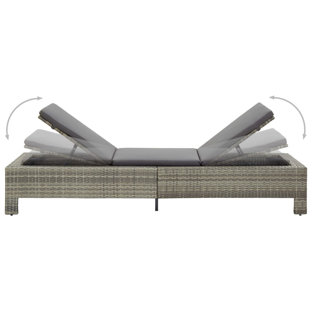 Adjustable grey poly rattan sunbed with cushion, perfect for outdoor relaxation by the pool or patio.