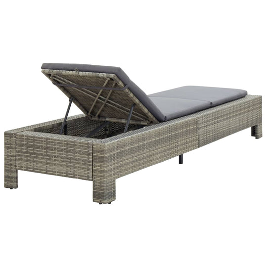 Comfortable grey poly rattan sunbed with cushion, adjustable backrest, perfect for outdoor relaxation by the pool or patio.