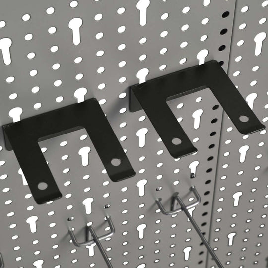 Wall-mounted pegboard hooks designed for tool organization, featuring durable steel construction and perforated panels.