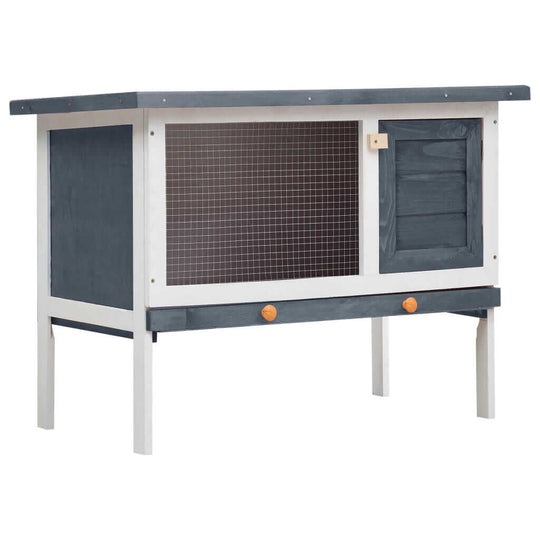 Outdoor rabbit hutch in grey wood with iron wire mesh, ideal for small animals' play and safety.