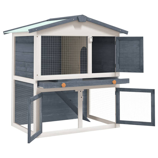 Outdoor rabbit hutch with three doors, gray wood finish, providing a cozy space for small pets.